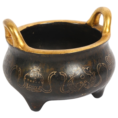 146 - A Chinese bronze 2-handled censer, with gold engraved decoration and character mark to the base, H9.... 