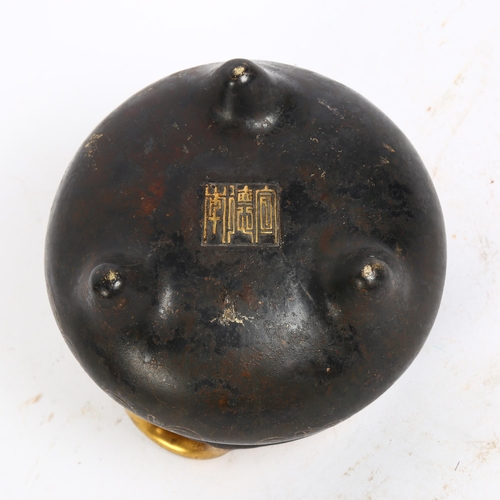 146 - A Chinese bronze 2-handled censer, with gold engraved decoration and character mark to the base, H9.... 