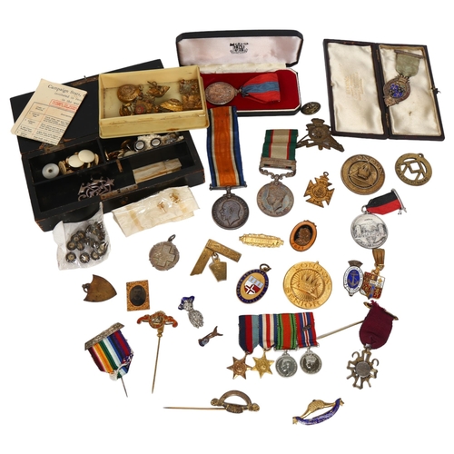 152 - A collection of various military badges medals and others, including a silver-gilt and enamel stewar... 