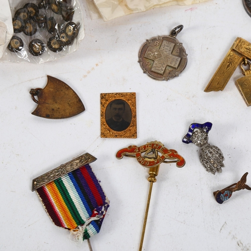 152 - A collection of various military badges medals and others, including a silver-gilt and enamel stewar... 