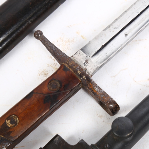 155 - A First World War Period bayonet, impressed A4553 to the hilt and leather scabbard, L43cm, together ... 