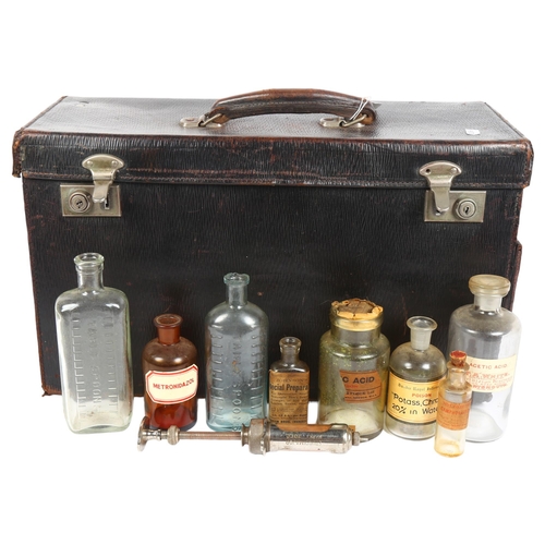 157 - An early 20th century leather physician's case, with various bottles and syringes, no maker's mark