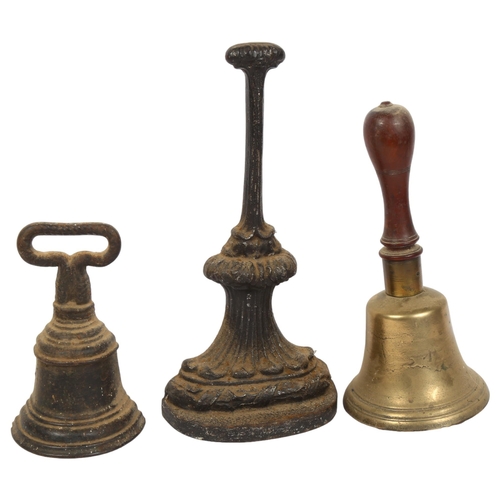 160 - 2 cast-iron doorstops, tallest 35cm, and a brass bell with turned wood handle, H29cm