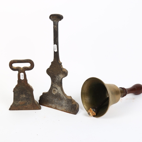 160 - 2 cast-iron doorstops, tallest 35cm, and a brass bell with turned wood handle, H29cm