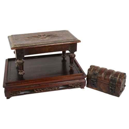 162 - A rectangular Chinese rosewood stand, with carved and pierced frieze, L37cm, a small carved oak stoo... 