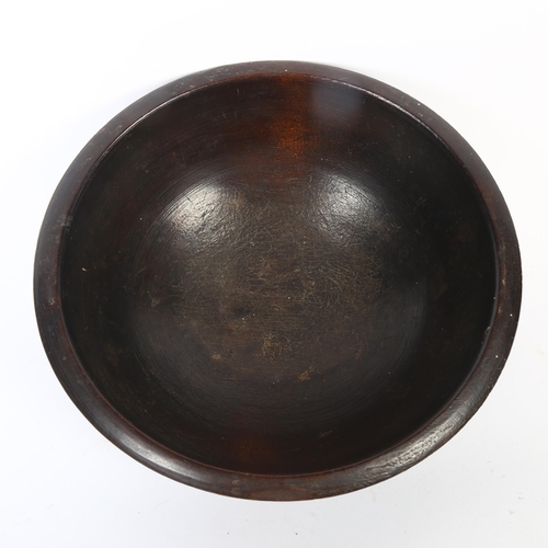 17 - A 20th century turned wood fruit bowl of  irregular shape,  with ribbed decoration, maximum diameter... 