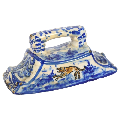 173 - An 18th century Dutch Delft pottery desk blotter with polychrome design of a dog, length 17cm