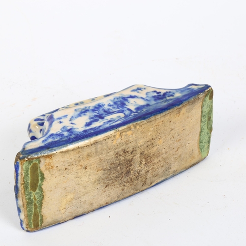 173 - An 18th century Dutch Delft pottery desk blotter with polychrome design of a dog, length 17cm