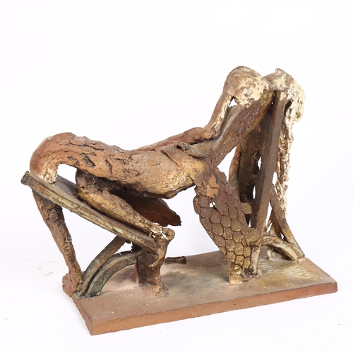 190 - An Art pottery stylised sculpture of a reclining figure, H26cm