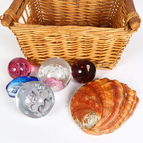 208 - A group of five glass paperweights and a shell