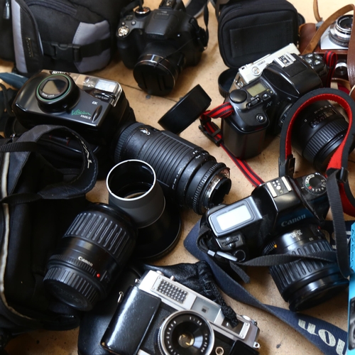 213 - A box of various cameras and equipment, including a Canon EOS 350D, a Eumig Mini 5 camera, a Petri 7... 