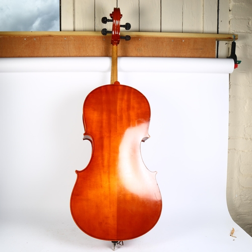 218 - A Hungarian three quarter size cello, no maker's marks or labels, with bow and associated carry case... 