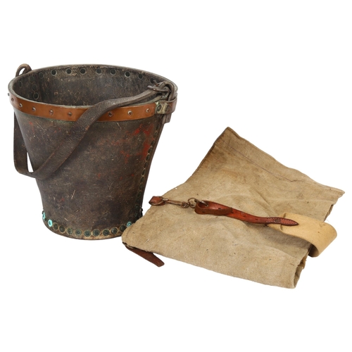 22 - A 19th century leather steel and copper-bound fire bucket, with leather handle, diameter 28cm, heigh... 
