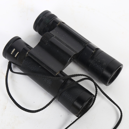 25 - A pair of Leitz Wetzlar Trinovid 10x22c binoculars, serial no. 915653, L10.5cm