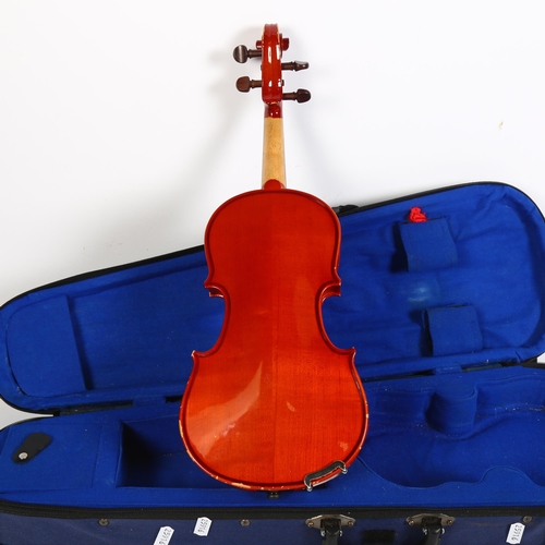 256 - A half-size violin, with label reading 