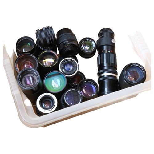 267 - A large quantity of camera lenses, including such brands as Canon, Bell & Howell, Praktica Photax et... 