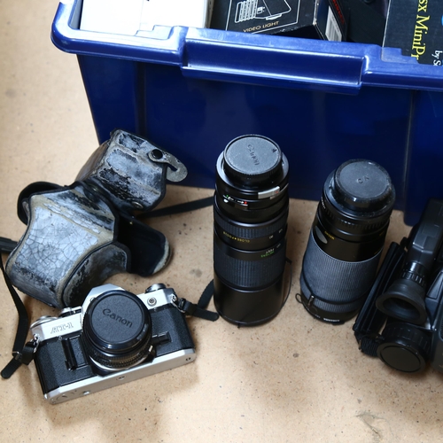 275 - A quantity of Vintage cameras and associated equipment, including a Canon AT-1, a JVC compact VHS vi... 