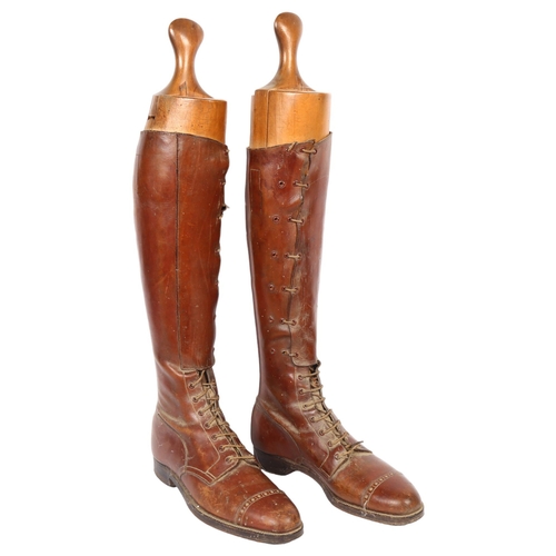 30 - A pair of early 20th century brown leather military riding boots and trees, boot height 48cm, unknow... 
