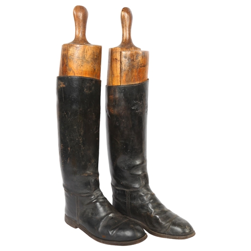31 - A pair of early 20th century black leather riding boots and trees, boot height 45cm, unknown size bu... 