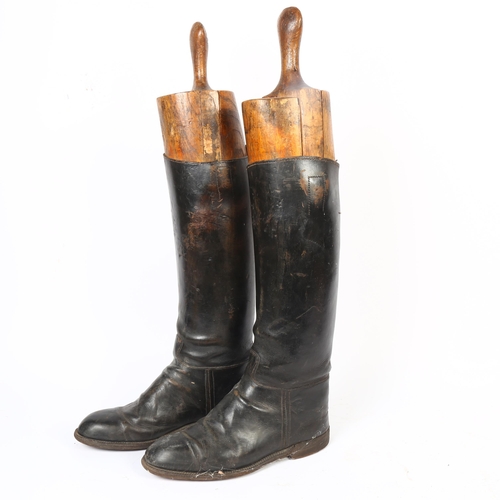 31 - A pair of early 20th century black leather riding boots and trees, boot height 45cm, unknown size bu... 