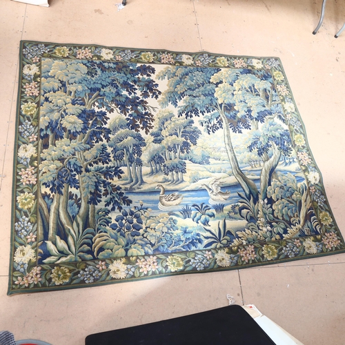 315 - A machine woven, possibly French, tapestry depicting a woodland or landscape scene, with ducks swimm... 