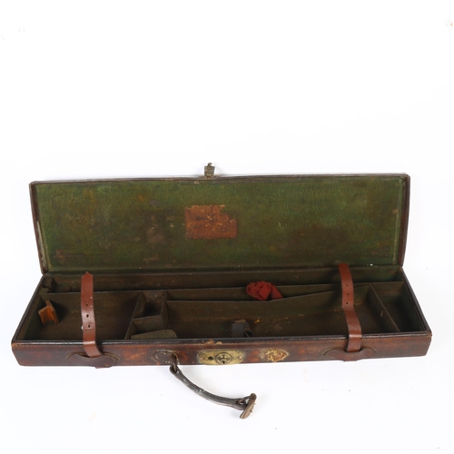 33 - A Victorian leather gun case, with leather straps, L82cm, maker's label is partially missing