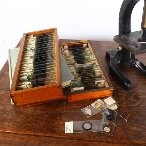 342 - A Vintage microscope, and several cases of slides, including many floral, pollen and insect related,... 