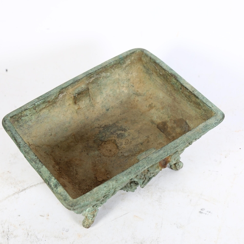 343 - A Chinese verdigris bronze Archaic style 'Dragon' censer, with relief decoration and character marks... 