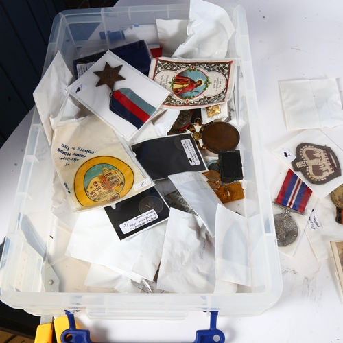 350 - A quantity of military ephemera, badges, medals, and other items, including a USA Good Conduct medal... 