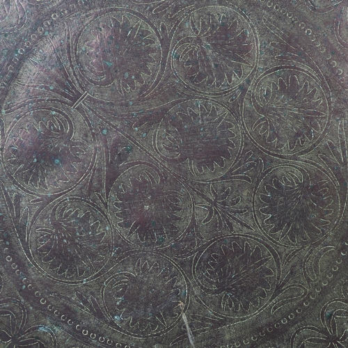 38 - A large Persian tin tray with engraved decoration, diameter 67.5cm