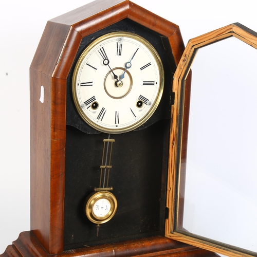 383 - A walnut-cased 8-day mantel clock, with glass-fronted door, and pendulum, H45cm