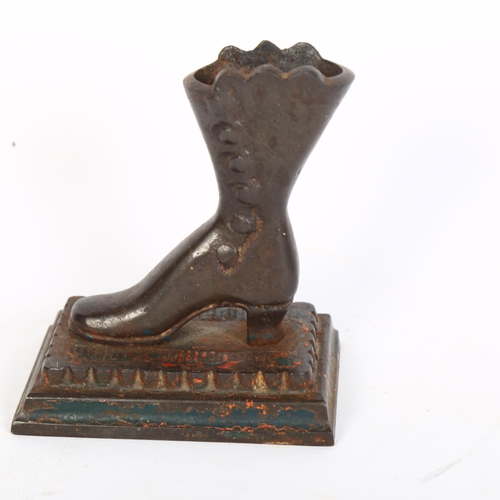 391 - A bronze sculpture of a lady's boot, H13cm