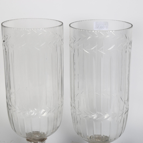 397 - A pair of glass hurricane vases, H40cm