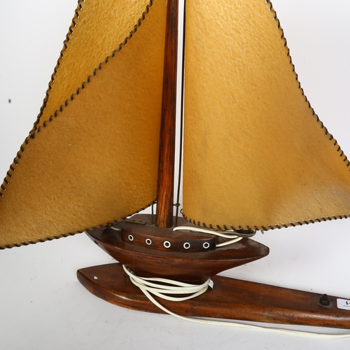 401 - A wooden sailing ship design table lamp, H55cm