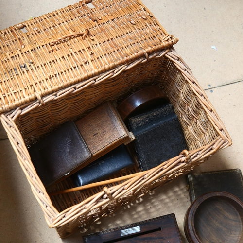 428 - A wicker hamper containing wooden boxes and empty cutlery boxes