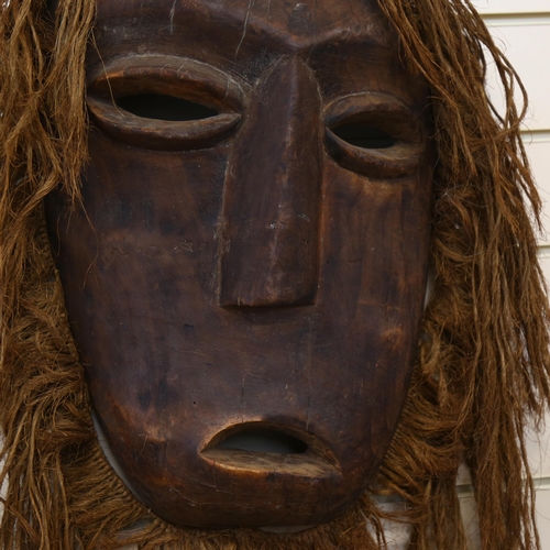 43 - A large Marli carved wood and rope mask, L50cm