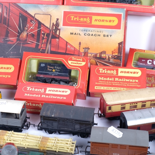 447 - TRI-ANG - HORNBY MODEL RAILWAYS - a quantity of boxed and unboxed trains, carriages and goods wagons... 