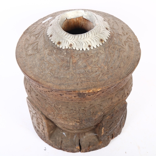 48 - A large Tunisian carved hardwood coffee grinder, H31cm