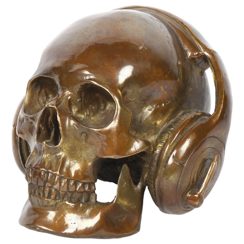 5 - An unusual bronze skull and headphones, H15cm, W16cm