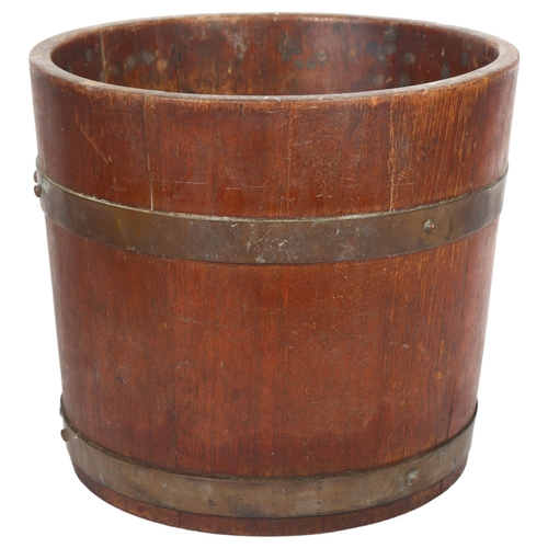 51 - R A Lister & Company Ltd, a coopered oak planter, with label, diameter 31cm, height 27.5cm