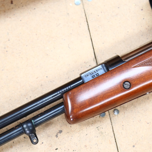 59 - A Weihrauch HW97K .22 calibre air rifle, with a Bush Master 4-12 X40 scope, overall length 102cm, co... 
