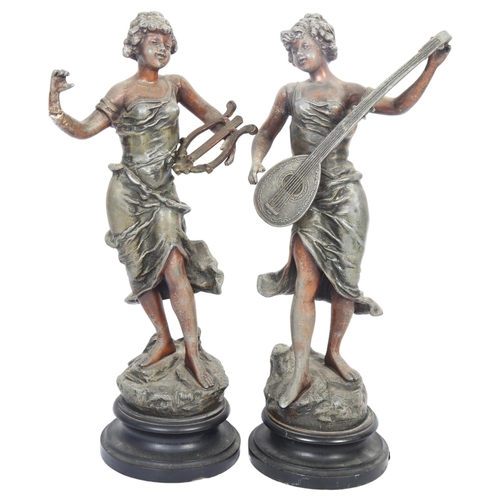 62 - A pair of patinated spelter musician figures on turned wood base, H42cm