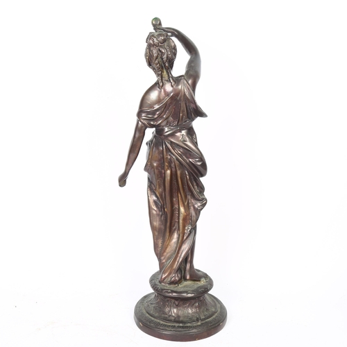 63 - A patinated bronze figure of a lady with a lamp, H55cm, unmarked