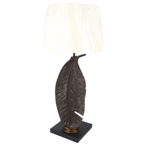 646 - A contemporary cast-metal lamp in the form of a feather, with LED bulb, and shade, H74cm