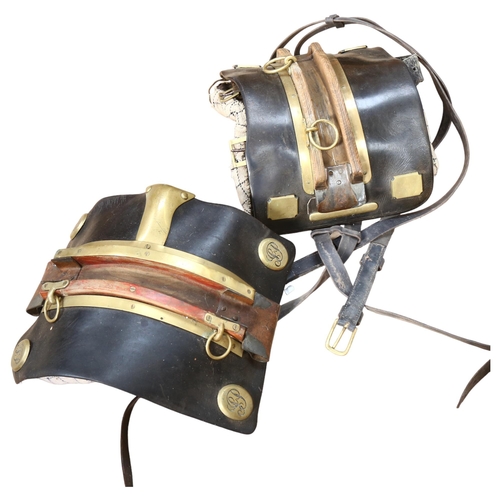 70 - A pair of early 20th century leather and brass-mounted heavy horse back panels, with leather straps