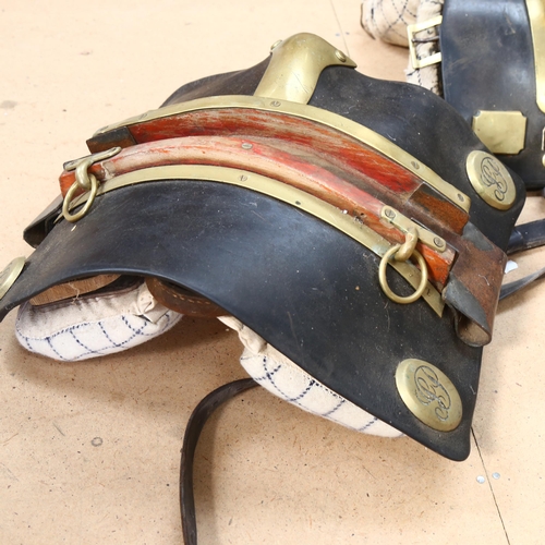 70 - A pair of early 20th century leather and brass-mounted heavy horse back panels, with leather straps