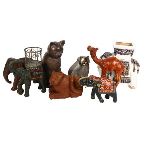 767 - A ceramic elephant design planter, H29cm, 3 other elephants, a leather-covered camel, and 3 cats