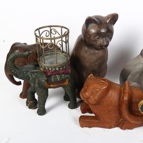 767 - A ceramic elephant design planter, H29cm, 3 other elephants, a leather-covered camel, and 3 cats