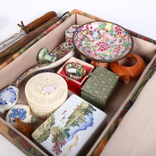 774 - A box containing snuff bottles, Oriental ceramic box, and a pair of Oriental carved wood carving set... 