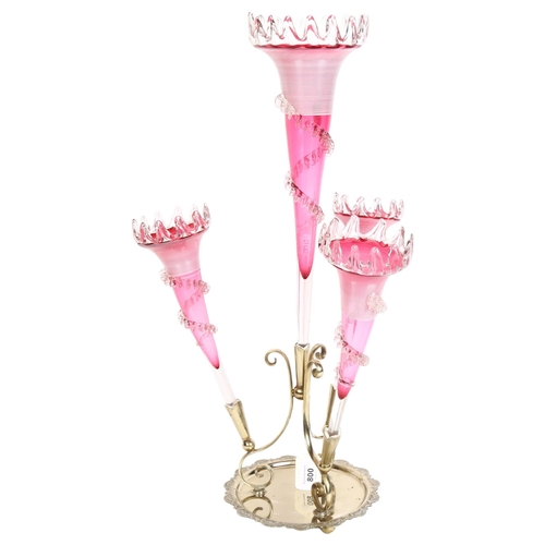 800 - A cranberry glass and silver plated table epergne, with 4 shaped trumpets, H58cm